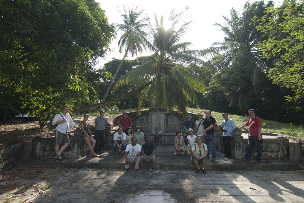 Brownies pose for a group picture with the care takers (seated at front left side) of Khoo Tiong Poh's grave